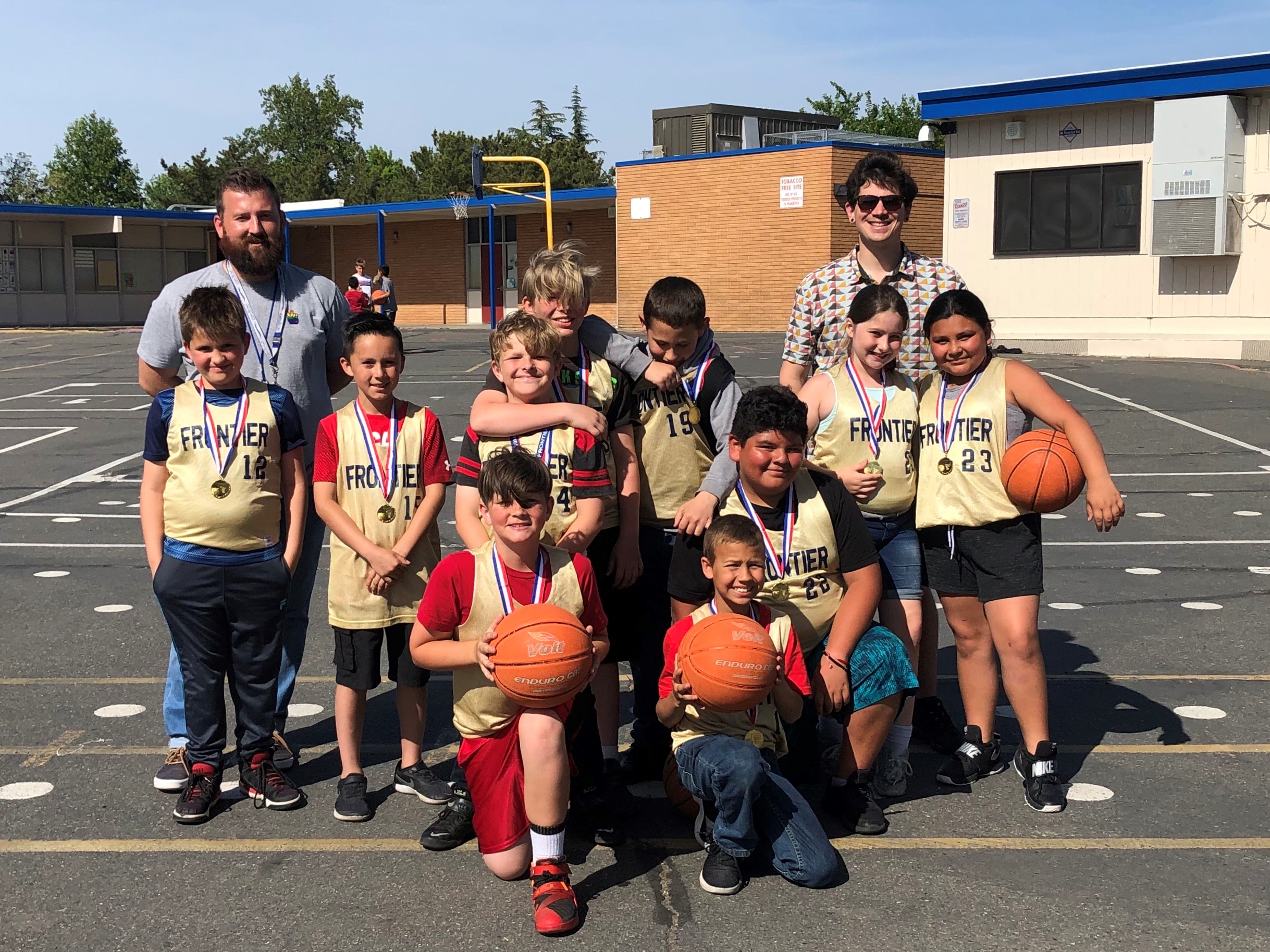 team picture of basketball team with coaches